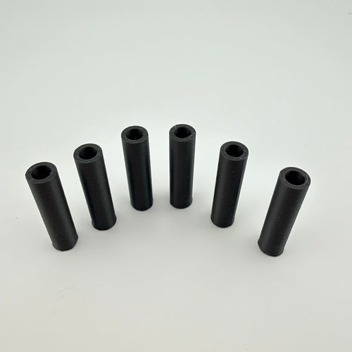Black carbon fiber reinforced 3D printed round tube spacers standing upright