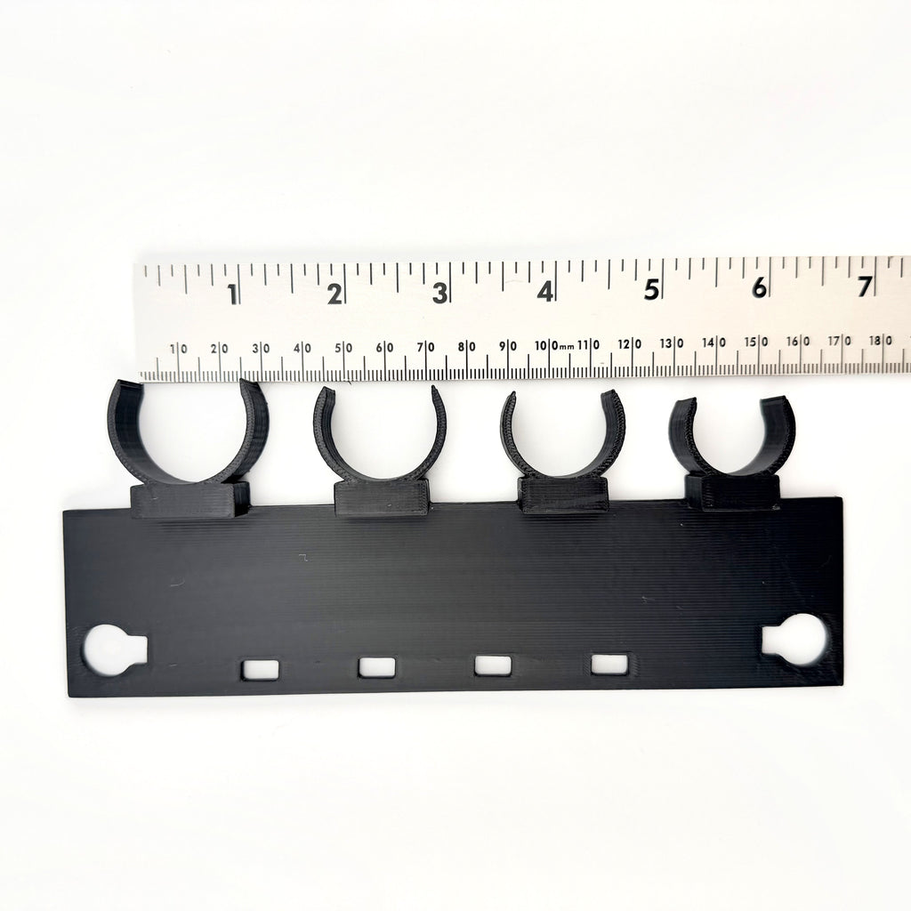 Four UQD cradle clips face on, sized for Staubli UQD04 and UQD06 plug and socket bodies