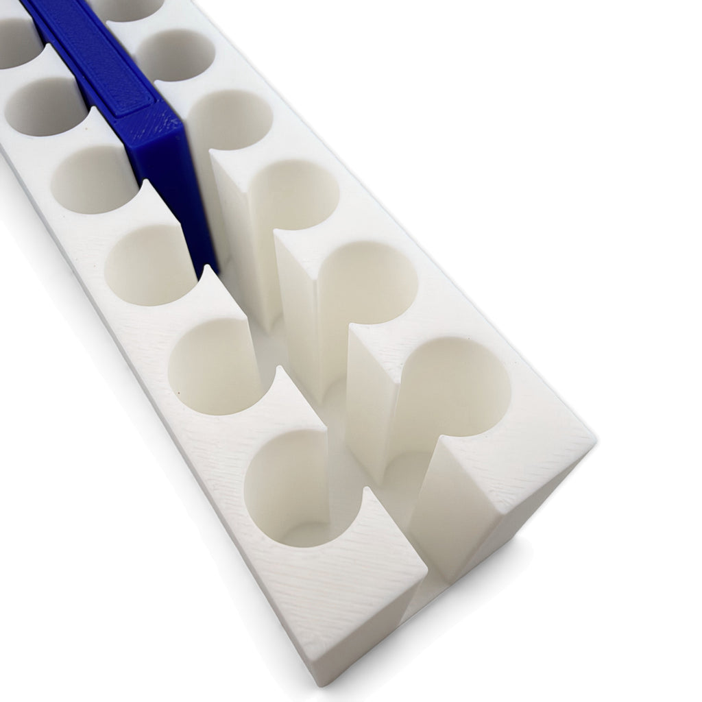 Close up of tube holes and center slot with the blue magnet bar